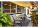 Cozy front porch with comfortable seating and ample natural light at 614 12Th Nw St, Largo, FL 33770