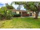 Quaint single-story home with a well-maintained lawn and mature landscaping at 614 12Th Nw St, Largo, FL 33770