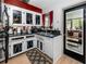 Bright kitchen with modern cabinets, black countertops, and stainless steel appliances at 614 12Th Nw St, Largo, FL 33770