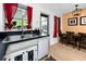 Updated kitchen with stainless steel sink, view to backyard, and dining area at 614 12Th Nw St, Largo, FL 33770