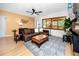 Comfortable living room, features hardwood floors, area rug, lots of light at 614 12Th Nw St, Largo, FL 33770