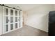 Spare bedroom with sliding closet doors and neutral carpeting throughout at 6913 Grande Vista S Way, St Petersburg, FL 33707