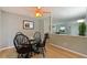 Cozy dining room with a round table, seating for four, and a decorative ceiling fan at 6913 Grande Vista S Way, St Petersburg, FL 33707