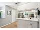 Bright kitchen with stainless steel appliances, ample counter space, and modern lighting at 6913 Grande Vista S Way, St Petersburg, FL 33707