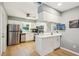 Well-lit kitchen featuring white cabinets, stainless steel appliances, and modern fixtures at 6913 Grande Vista S Way, St Petersburg, FL 33707