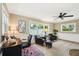 Bright living room with ceiling fan and bright windows at 6913 Grande Vista S Way, St Petersburg, FL 33707