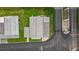 Aerial view of a single-story home with a well-maintained roof and a small yard at 7118 El Meyers St, Zephyrhills, FL 33541