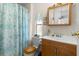 Bathroom has neutral color and wooden vanity at 7118 El Meyers St, Zephyrhills, FL 33541