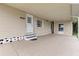 Spacious carport featuring a door entrance to the home and ample covered parking at 7118 El Meyers St, Zephyrhills, FL 33541
