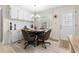 Inviting dining space with a round table, seating for four, and nearby storage at 7118 El Meyers St, Zephyrhills, FL 33541