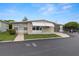 Charming single-story home featuring a covered carport and well-maintained landscaping at 7118 El Meyers St, Zephyrhills, FL 33541