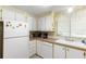 Functional kitchen with appliances, white cabinets, and ample counter space at 7118 El Meyers St, Zephyrhills, FL 33541