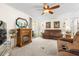 Living room has carpet, a fireplace, and sliding glass doors to bring sunlight into the home at 7118 El Meyers St, Zephyrhills, FL 33541