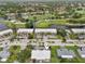 Aerial view showcasing the community's proximity to golf course and water features at 7304 W Country Club N Dr # 113, Sarasota, FL 34243