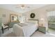 Light-filled bedroom with furniture, and a scenic outdoor view at 7304 W Country Club N Dr # 113, Sarasota, FL 34243