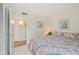 Bedroom featuring carpet, comfortable bed, closet, and view to entry at 7304 W Country Club N Dr # 113, Sarasota, FL 34243