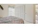 Bedroom view showcasing closet, furnishings, and sliding door to balcony at 7304 W Country Club N Dr # 113, Sarasota, FL 34243