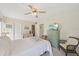 Bedroom featuring dresser, wicker furniture, carpet, and a ceiling fan at 7304 W Country Club N Dr # 113, Sarasota, FL 34243
