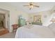 Bedroom with comfortable bed, dresser, wicker furniture, and carpet at 7304 W Country Club N Dr # 113, Sarasota, FL 34243
