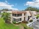 Well-maintained condo building with lush landscaping and ample parking at 7304 W Country Club N Dr # 113, Sarasota, FL 34243