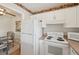 Efficient kitchen with white appliances, ample cabinet space, and convenient access to dining area at 7304 W Country Club N Dr # 113, Sarasota, FL 34243