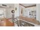 Bright and modern kitchen with white cabinetry, a breakfast bar, and easy access to dining and living areas at 7304 W Country Club N Dr # 113, Sarasota, FL 34243