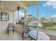 Cozy lanai with seating area offers tranquil views of the outdoors at 7304 W Country Club N Dr # 113, Sarasota, FL 34243