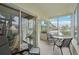 Inviting lanai featuring tile floors and comfortable seating arrangement at 7304 W Country Club N Dr # 113, Sarasota, FL 34243
