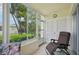 Relaxing patio space with seating and lush tropical views at 7304 W Country Club N Dr # 113, Sarasota, FL 34243