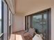 Enjoy outdoor seating on the covered balcony with views of the water and marina at 7600 Sun Island S Dr # 603, South Pasadena, FL 33707