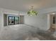Large open living area with balcony access and decorative lighting at 7600 Sun Island S Dr # 603, South Pasadena, FL 33707