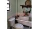 Bathroom showcasing a classic clawfoot tub and vintage-style decor at 7608 Chenkin, Zephyrhills, FL 33540