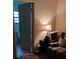 Bedroom with a view of a bathroom, chair, and a patterned rug on the floor at 7608 Chenkin, Zephyrhills, FL 33540