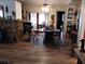 Dining Room with luxury vinyl flooring, a ceiling fan, and access to the kitchen and living room at 7608 Chenkin, Zephyrhills, FL 33540