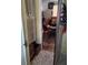 Hallway featuring a storage closet and leading into the dining room at 7608 Chenkin, Zephyrhills, FL 33540