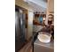 Traditional kitchen design with stainless steel refrigerator, cabinets, and appliances at 7608 Chenkin, Zephyrhills, FL 33540