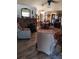 Open-concept living room with a stone fireplace and wood-style flooring at 7608 Chenkin, Zephyrhills, FL 33540