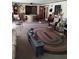 Spacious living room with a large rug and comfortable seating at 7608 Chenkin, Zephyrhills, FL 33540