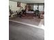 Cozy sunroom featuring a colorful rug and vintage furniture at 7608 Chenkin, Zephyrhills, FL 33540
