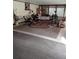 Cozy sunroom featuring a colorful rug and vintage furniture at 7608 Chenkin, Zephyrhills, FL 33540