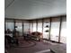 This sunroom is filled with natural light and rustic decor at 7608 Chenkin, Zephyrhills, FL 33540