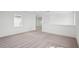 Bright, carpeted bedroom with white walls, trim, and ample space, enhancing the sense of openness at 8316 Golden Beach Ct, Parrish, FL 34219