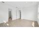 Bright bedroom featuring neutral walls, modern recessed lighting, and multiple doorways at 8316 Golden Beach Ct, Parrish, FL 34219