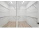 Spacious walk-in closet with dual access and ample shelving for storage at 8316 Golden Beach Ct, Parrish, FL 34219