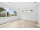 Sunlit flex room featuring neutral decor and large windows with a trey ceiling at 8316 Golden Beach Ct, Parrish, FL 34219