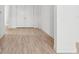 Bright foyer showcasing wood floors, white walls, and double front doors, creating an inviting entrance at 8316 Golden Beach Ct, Parrish, FL 34219
