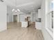 Spacious open-concept kitchen with an island, stainless steel appliances, and bright tile floors throughout the home at 8316 Golden Beach Ct, Parrish, FL 34219
