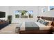 Virtually Staged: Well-lit bedroom with stylish furnishings and a serene ambiance at 8316 Golden Beach Ct, Parrish, FL 34219