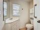 Functional bathroom featuring a single vanity, a toilet, and grab bars at 8822 Misty Creek Dr, Sarasota, FL 34241