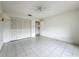 Bright, open bedroom with a ceiling fan and closet for storage at 8822 Misty Creek Dr, Sarasota, FL 34241